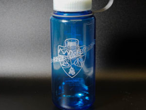 blue water bottle with cedar lake camp logo