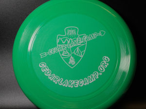 green frisbee with CLC logo
